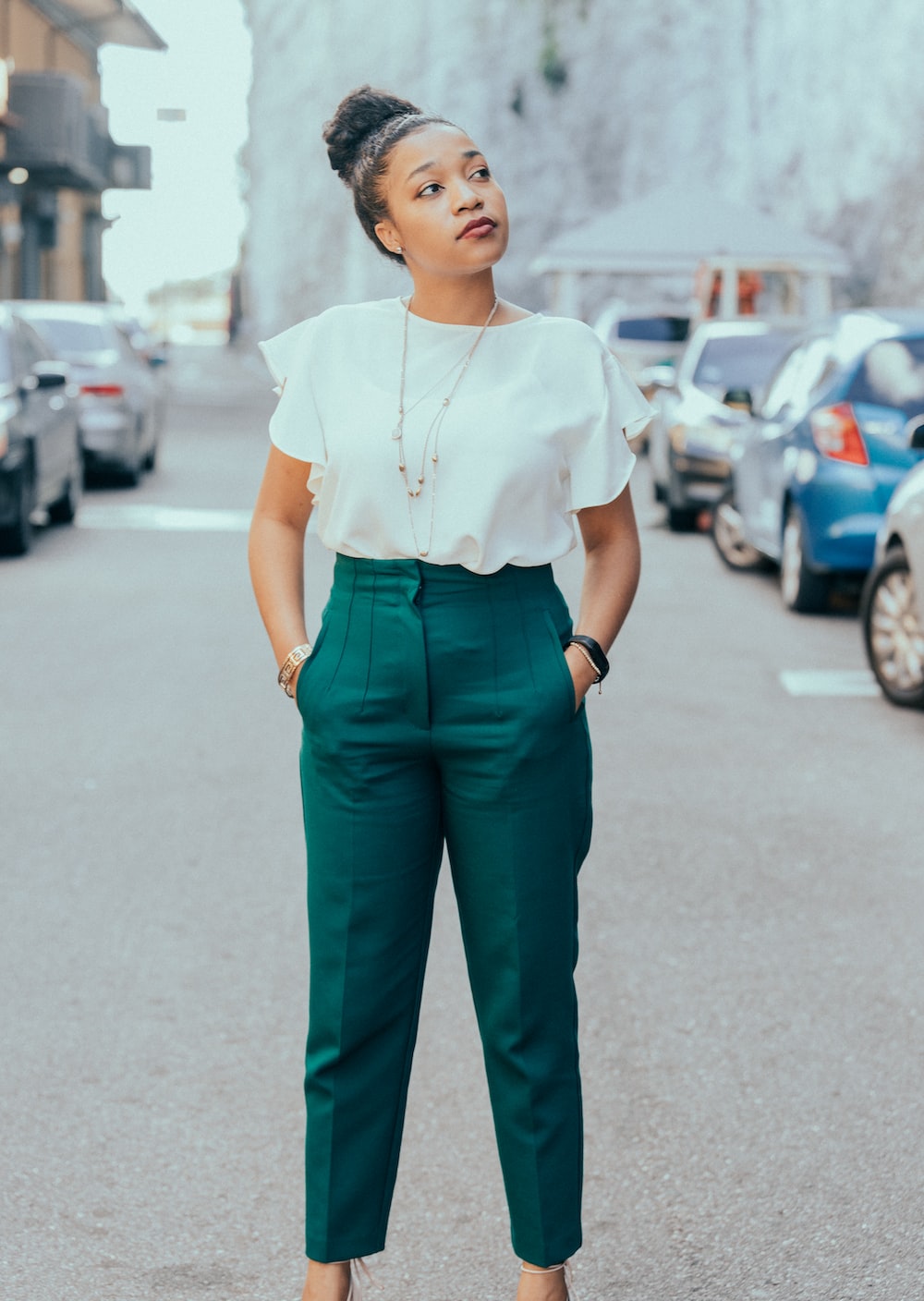 Woman in white shirt and black pants standing on road during daytime photo – Free The bahamas Image on Unsplash