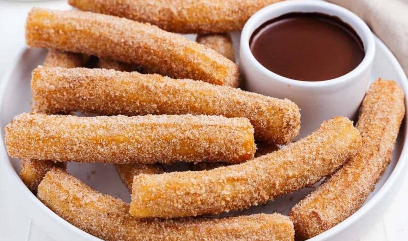 Vegan Cinnamon Sugar Churros With Dark Chocolate Sauce | VegNews